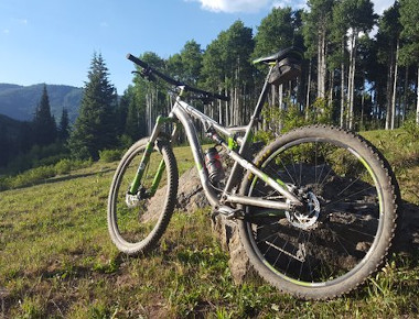 Mountain bike leaning against rock at Sunlight Mountain Resort